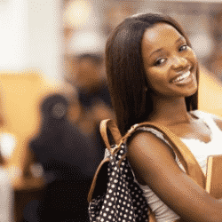 young black woman carrying backpack