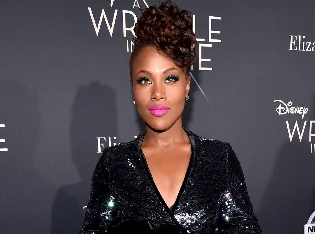 DeWanda Wise pictured at movie screeing with hair pinned up and wearing shiny black dress