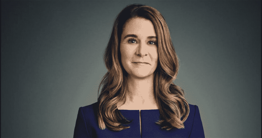 Melinda Gates in professional photo wearing a navy blue dress