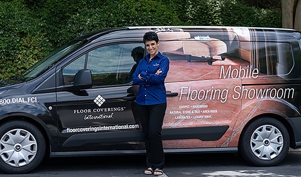 Emilia Navedo standing in front of her work vehicle