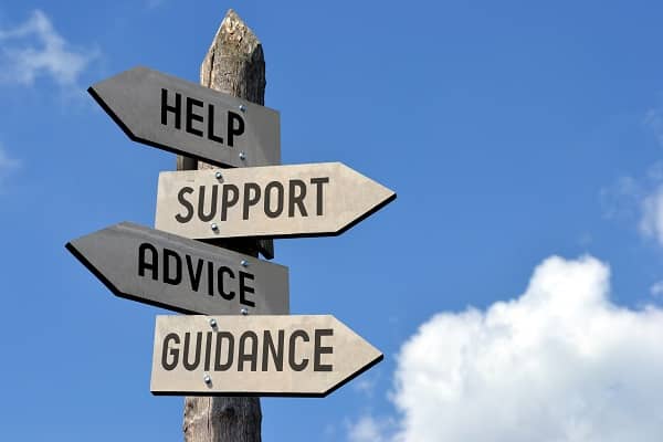 A collection of signs reading "help", "support", "advice", and "Guidance"
