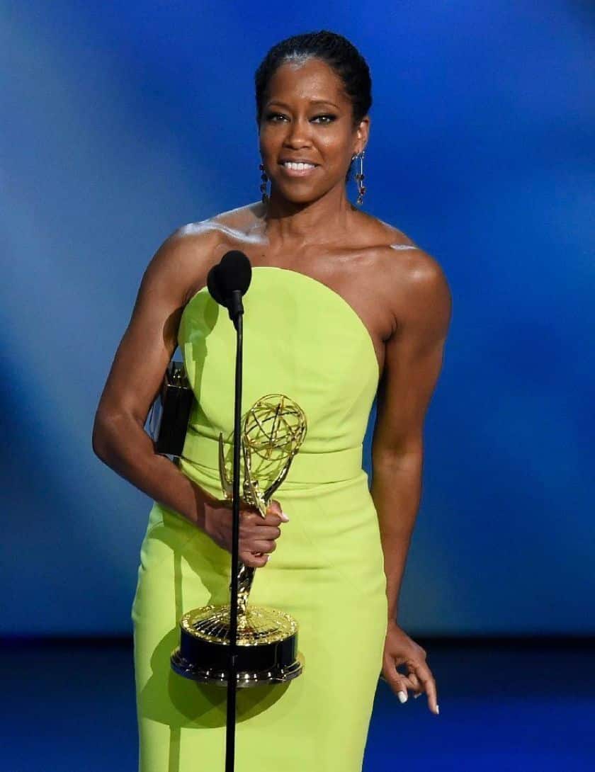 Regina King accepting Emmy while holding the emmy in hand