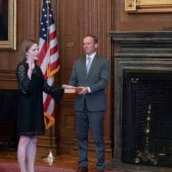 Chief Justice John G. Roberts (R) administers the Judicial Oath to U.S. Supreme Court Associate Justice Amy Coney Barrett as her husband Jesse Barrett holds the Bible in the East Conference Room, Supreme Court Building on October 27, 2020 in Washington, DC. (Photo by Fred Schilling/Collection of the Supreme Court ofthe U.S.