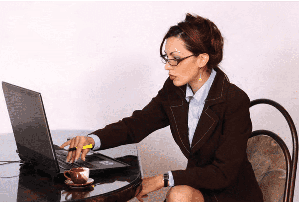 professional woman working from during pandemic on her latop