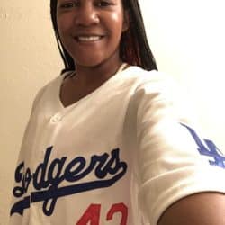 Bianca Smith smiles wearing a baseball jersey