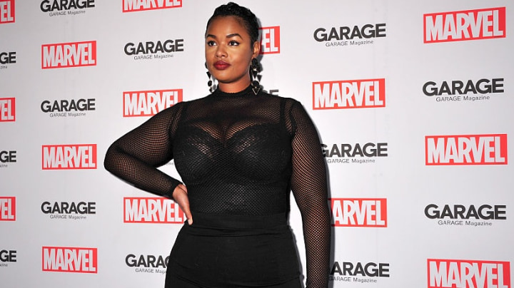 Precious Lee plus-sized model at a marver premier wearing a black bodycon dress