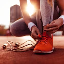 Image of the lower half of a Woman who is preparing for jogging