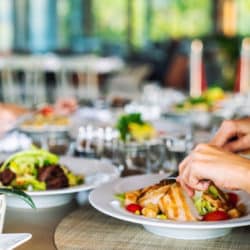 A group of people is dining in a elegance restaurant or hotel