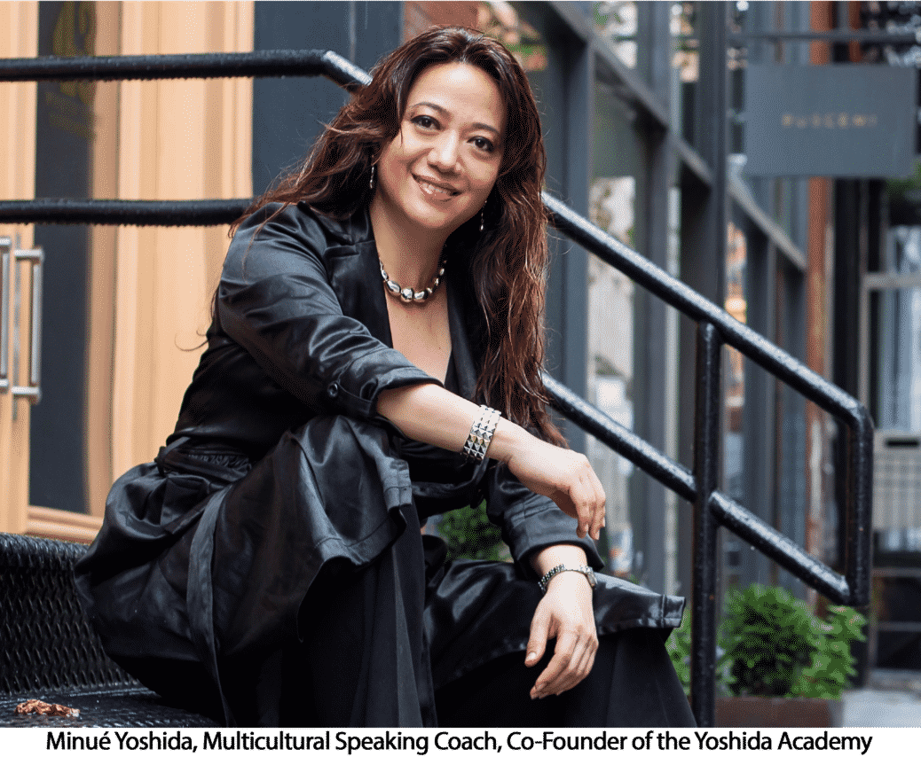 Woman in black jacket and pants smiling sitting on stairs
