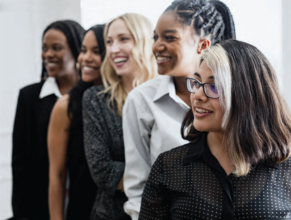 diverse group of women entrepreneurs facing sideways in a line