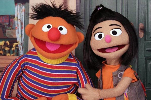 Ernie, a muppet from the popular children's series "Sesame Street," appears with the new character Ji-Young, the first Asian American muppet.