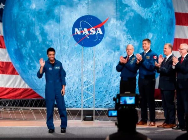 NASA astronaut Jessica Watkins waves at the audience during the astronaut graduation ceremony at Johnson Space Center in Houston, Texas, in January 2020. In April 2022, she will become the first Black woman to live and work on the International Space Station.