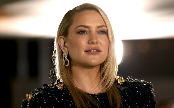 Kate Hudson from the shoulders up, looking into the distance