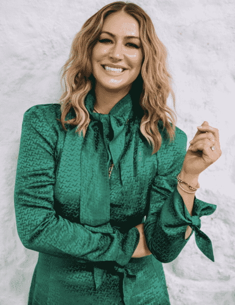 Fitness Trainer Karena Dawn smiling at the camera in a green silk button up shirt