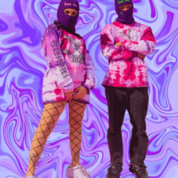 Malcriadas Collective instagram post. Two people standing in front of a purple computer animated background