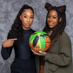 Jasmine Jordan and peer holding up a basketball