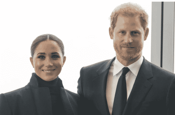 meghan markle and prince harry kicking off woman's history month and smiling at the camera
