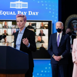 in honor of international women's day, the washington post posted U.S. Soccer Women's National Team member Megan Rapinoe speaks as President Biden and first lady Jill Biden watch during an event to mark Equal Pay Day in D.C. in March 2021. (Evan Vucci/AP)