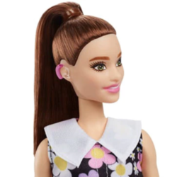 Barbie wearing a hearing aid