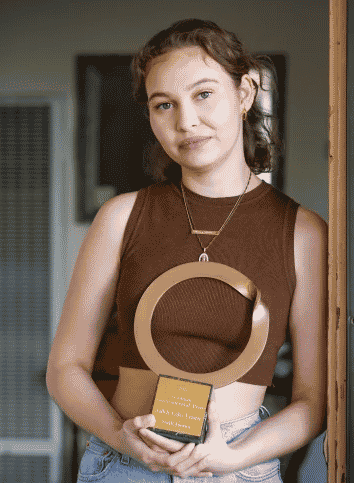 Nalleli Cobo holds the ouroboros environmental prize