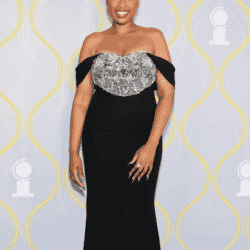 Jennifer Hudson on the red carpet in a black off the shoulder gown