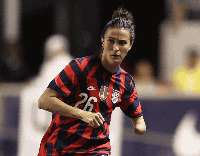 Pro soccer player Carson Pickett on the field in her uniform