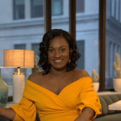 Beverly Malbranche wearing a yellow shirt and smiling at the camera