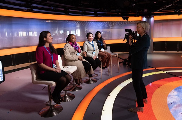 four professional woman on a panel board with woman photographer
