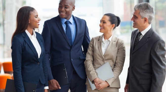 diverse business group walking and talking