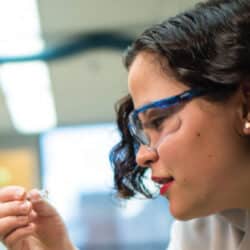 woman scientist looking at test tube