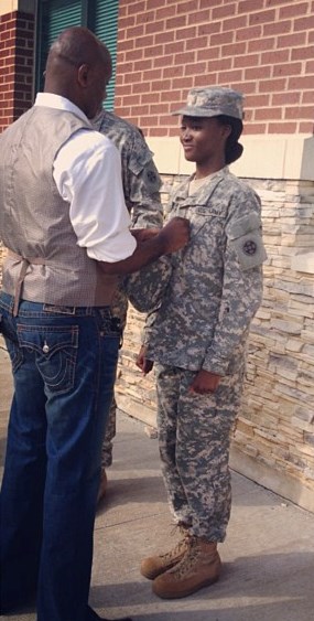eshauna Barber being pinned as a first lieutenant by her father,